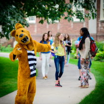 Nittany Lion mascot outside with students.