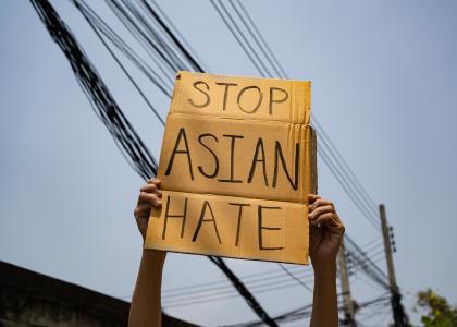 Cardboard sign that says: "Stop Asian Hate" 