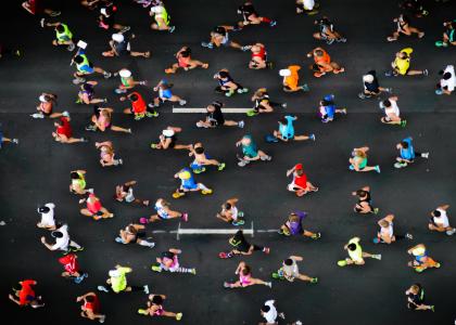 overhead shot of people running a marathon