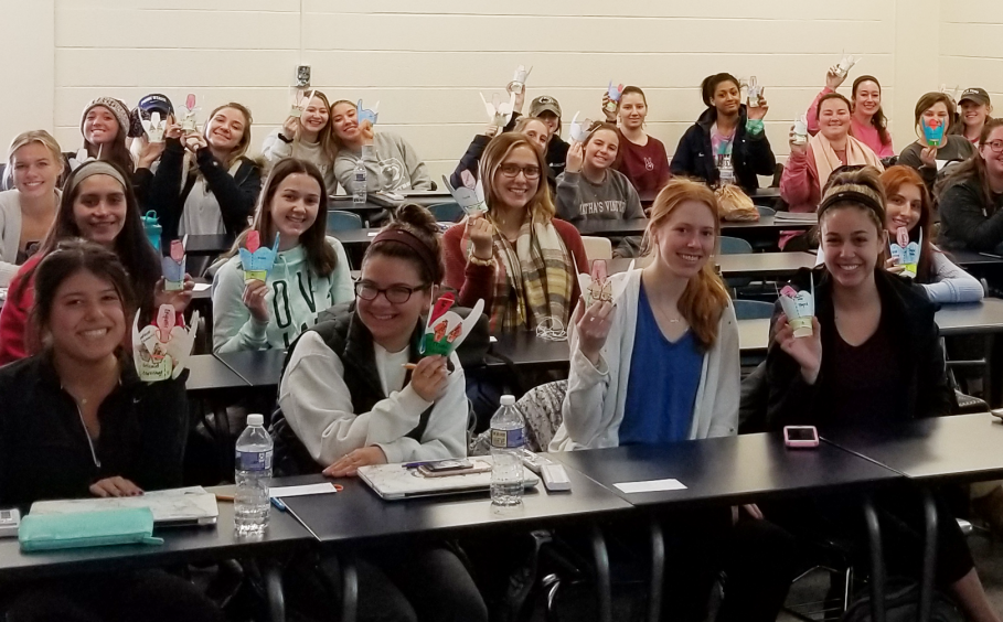 Students in CSD 331 show off their cardboard larynx models.