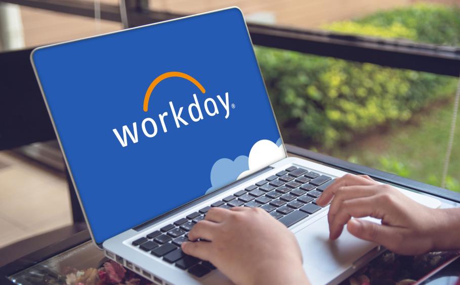 Person working a laptop with the Workday® logo on the screen