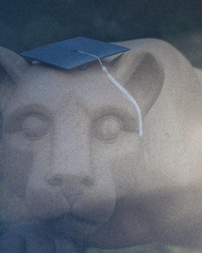 Nittany Lion Shrine with Mortar Board on head.