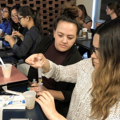 Students mix liquids in dysphagia lab