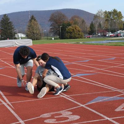 Trainers tending to an injured runner