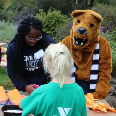 students and Nittany lion registering to volunteer