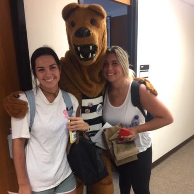 Students standing with Nittany Lion