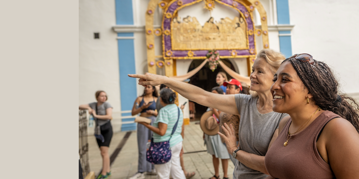 Dana Naughton and a Global Health Minor student at a tourist attraction in Mexico