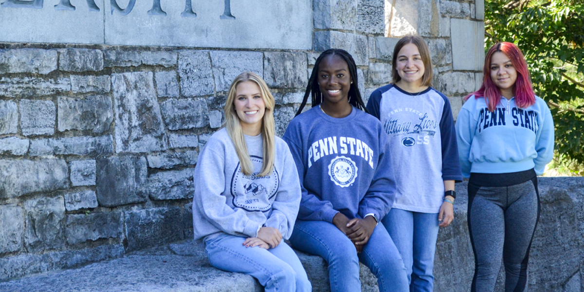 College Instagram ambassadors at the Penn State University sign