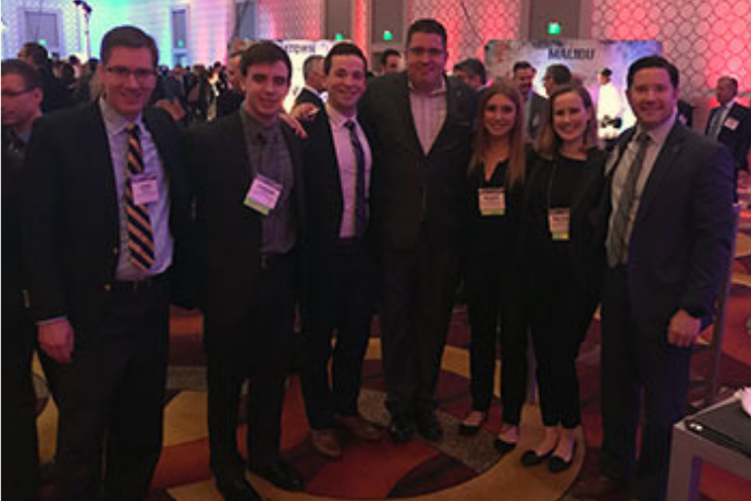 =Faculty, students and alumni gathered with hospitality industry real estate and strategy executives at the annual Americas Lodging Investment Summit (ALIS) in Los Angeles. Left to right: John O'Neill, students Jordan Camut and Jeremy Belfer; Jason Loggie, alumnus and  Food and Beverage Director, Los Angeles Renaissance hotel; students Nicole Orie and Rachel Cowley; Brian Black, Director of Hospitality Industry and Alumni Relations